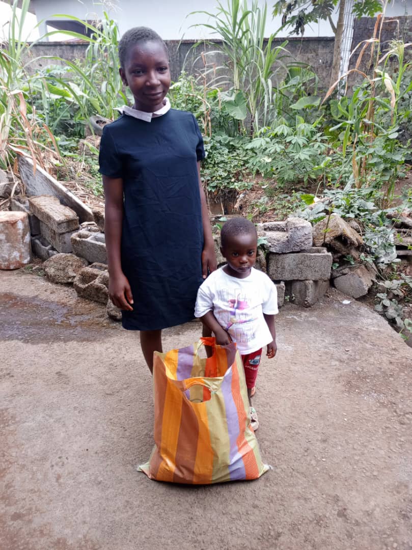 INADESU volunteers delivering food donations to vulnerable children and orphans
