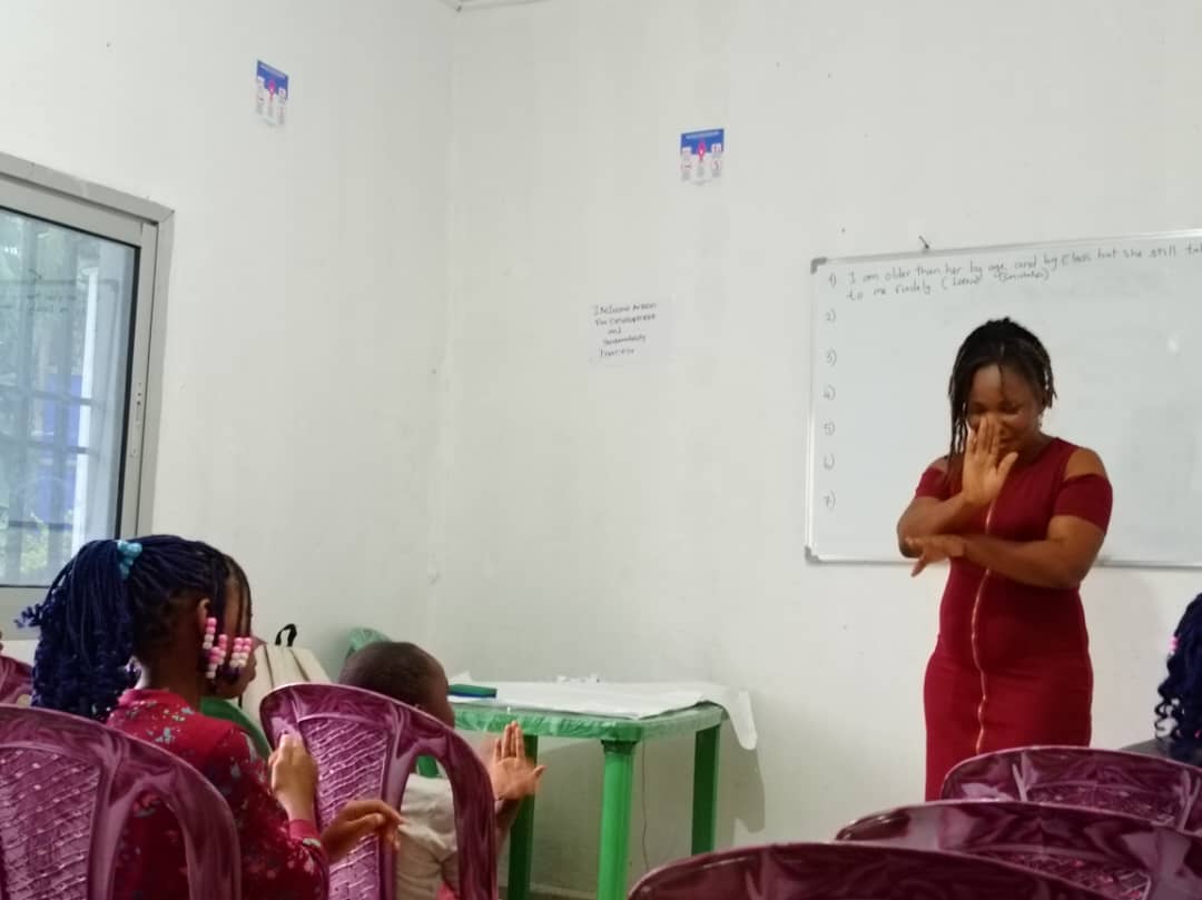 Children learning sign language communication skills